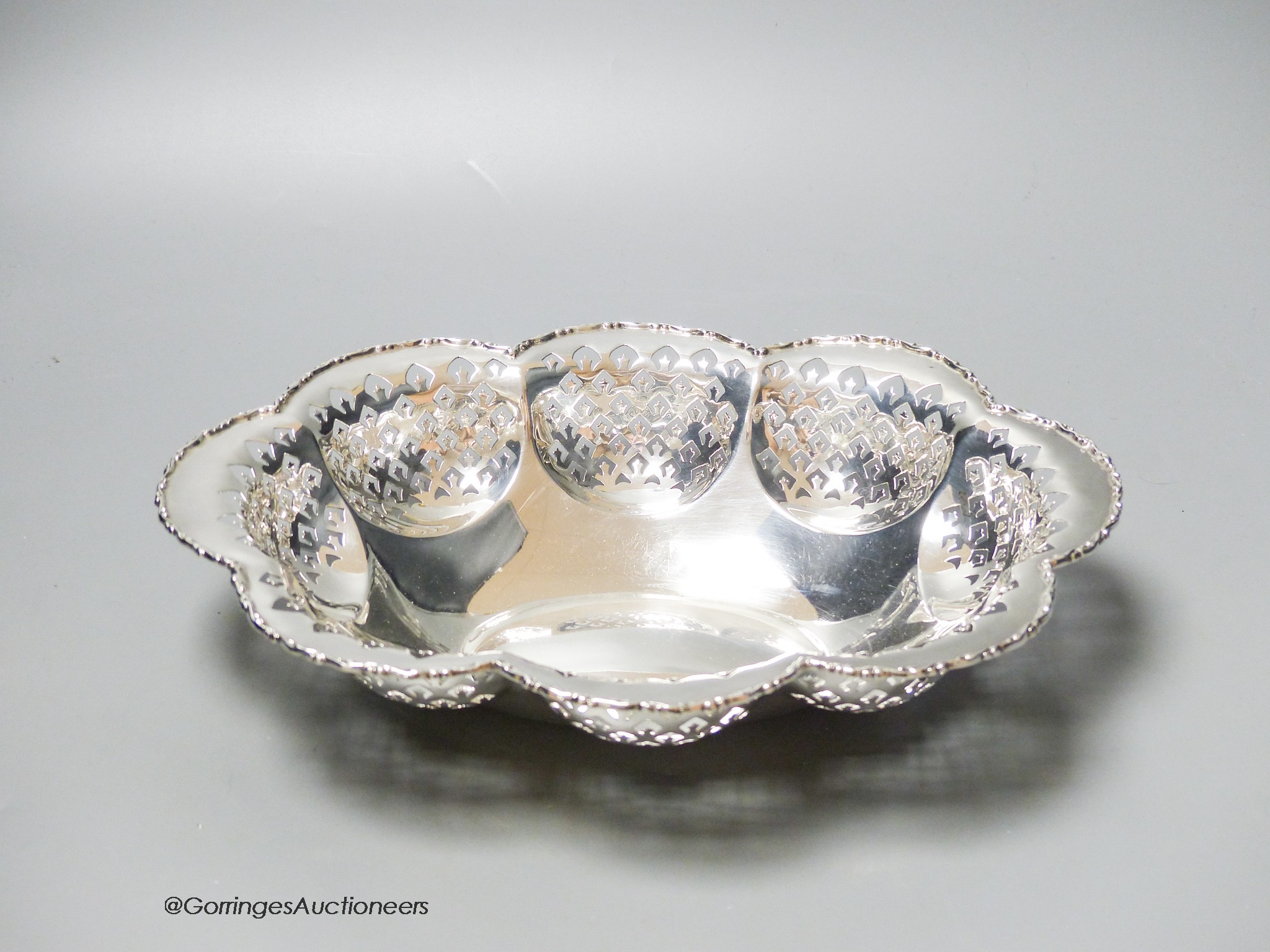 A George V lobed pierced silver oval bowl, Birmingham, 1928, 28.8cm, 12oz.